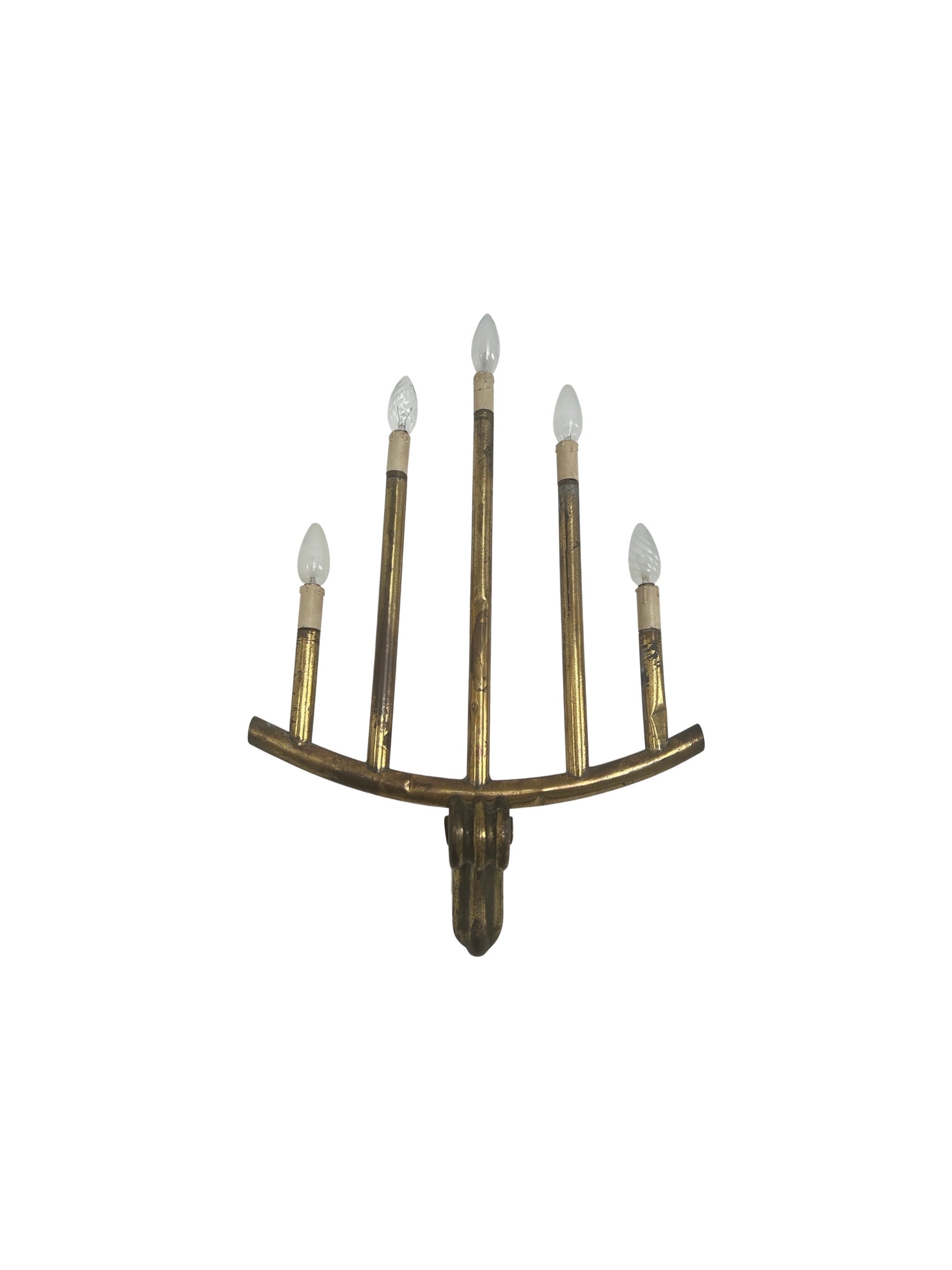 Decorative wall sconce with multiple candle-like lights on a white background