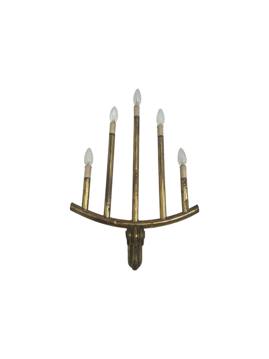 Decorative wall sconce with multiple candle-like lights on a white background