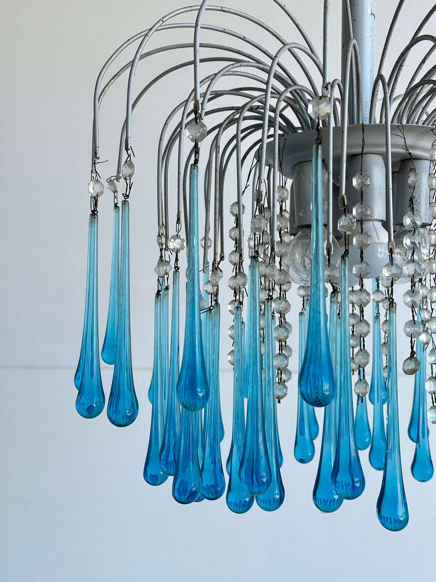 blue pendant light over white ceiling 