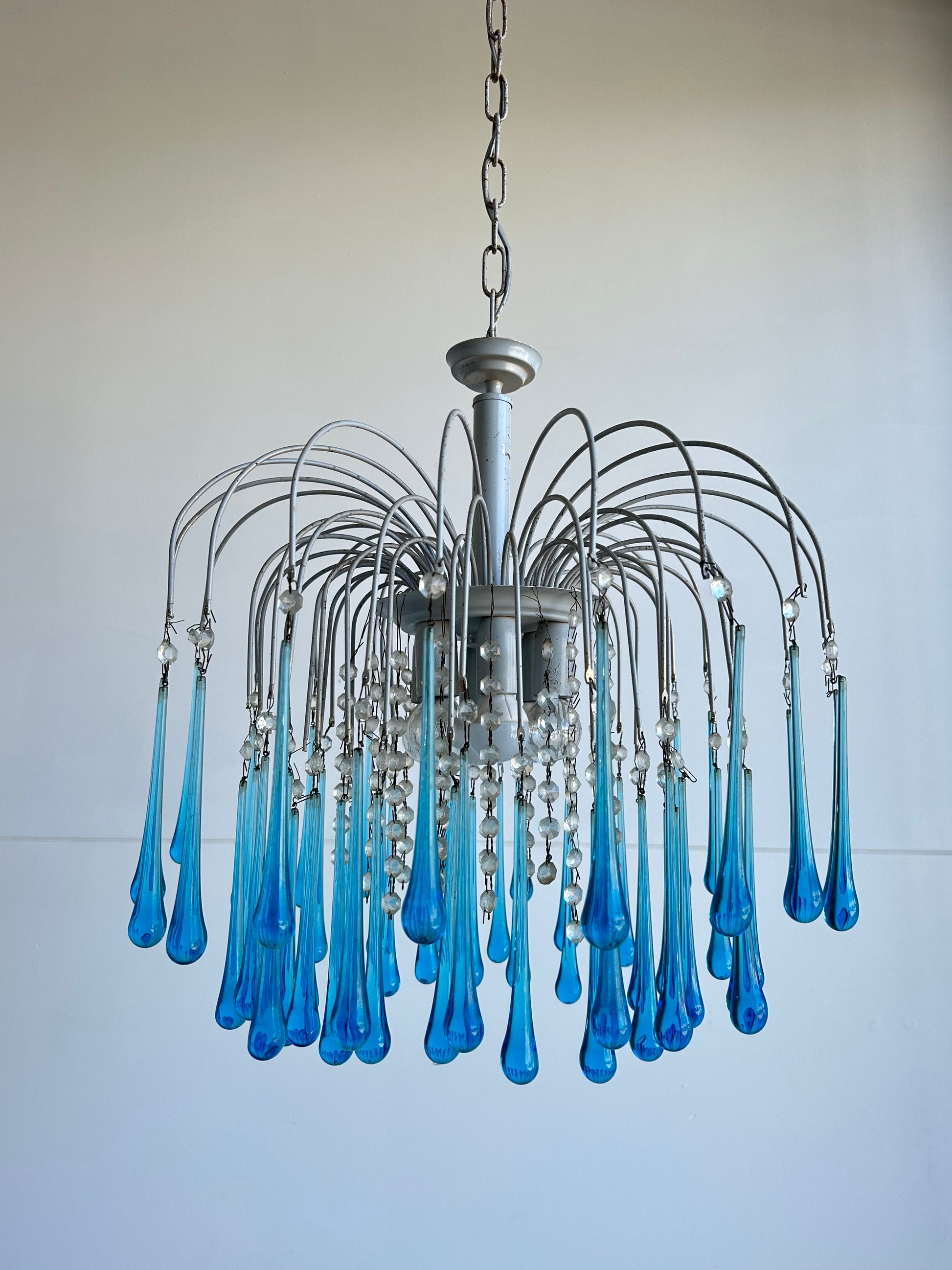 blue pendant light over a white background