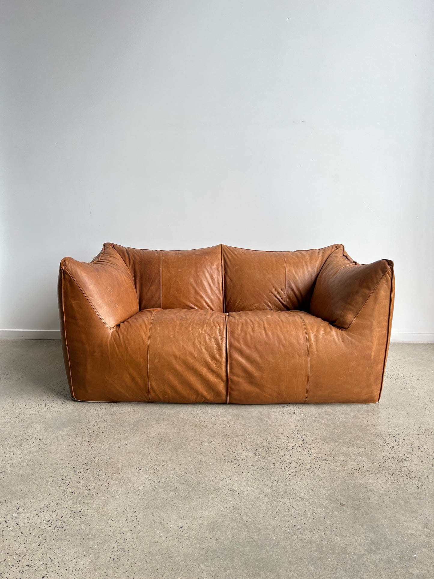 brown leather sofa in a neutral space