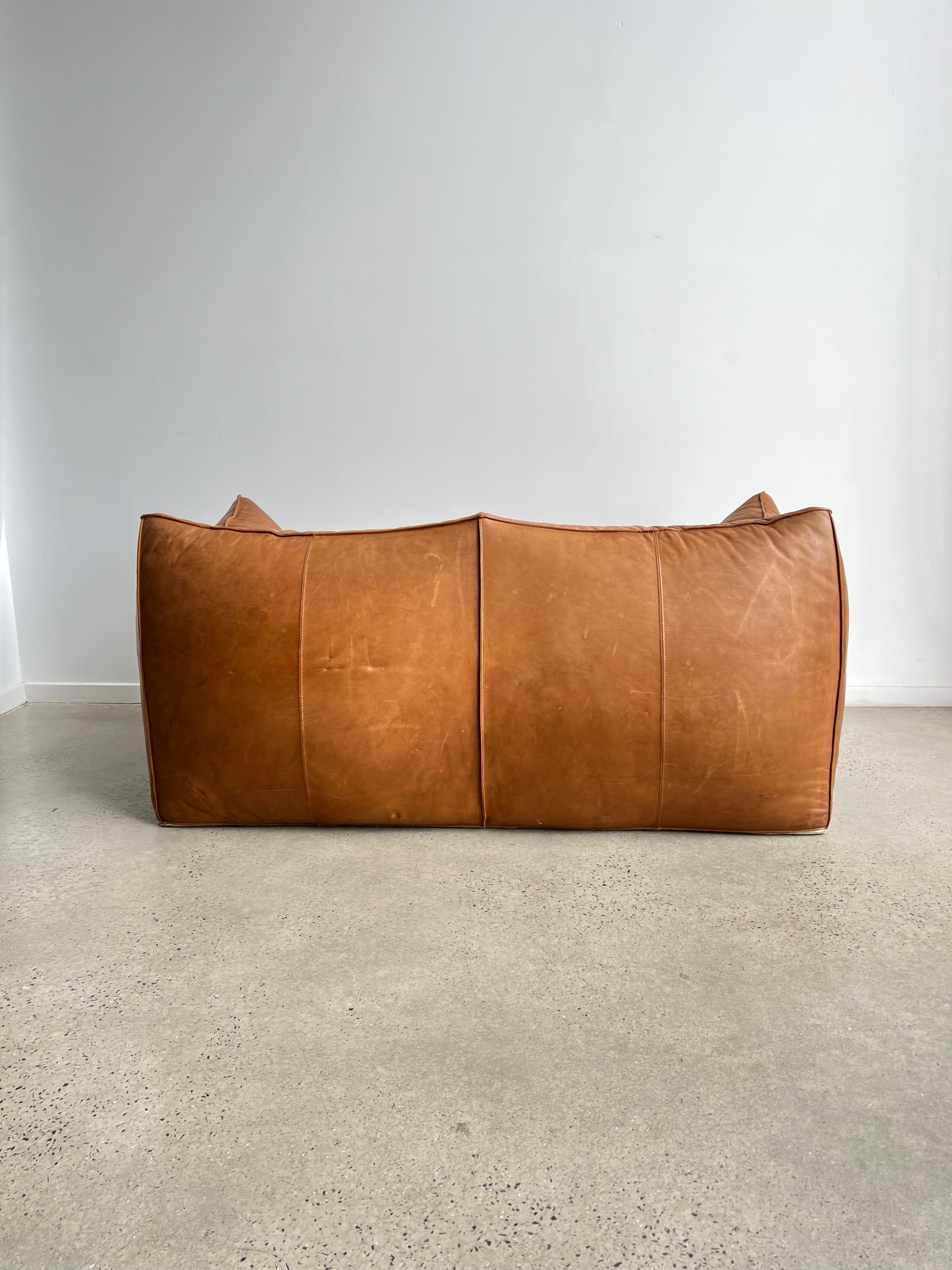 back of a brown leather sofa
