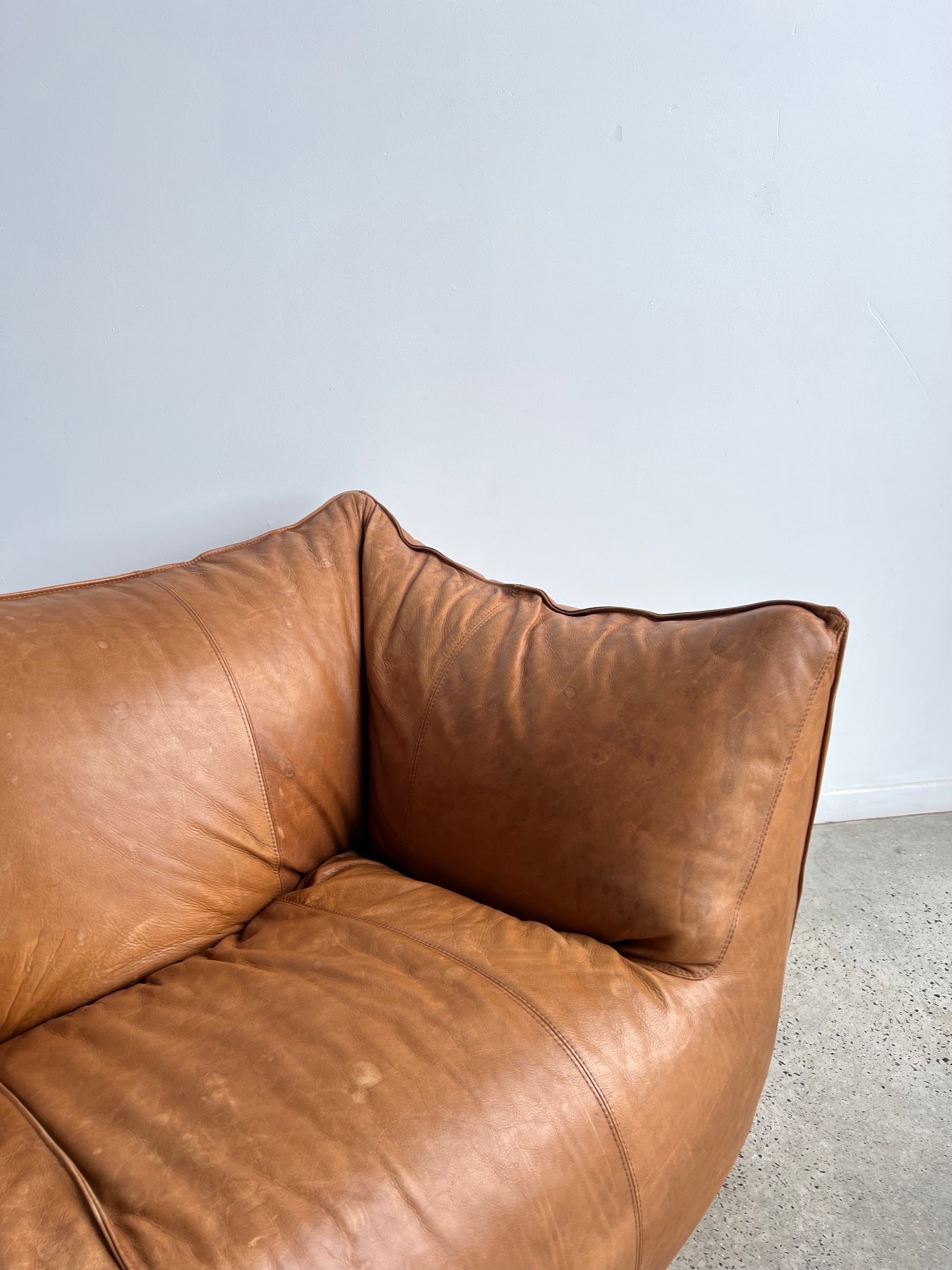 brown leather sofa in a neutral space