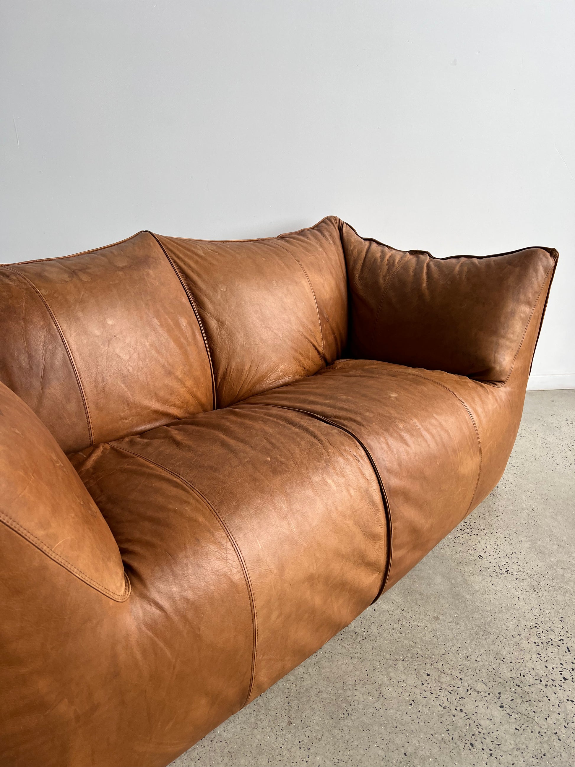 brown leather sofa in a neutral space