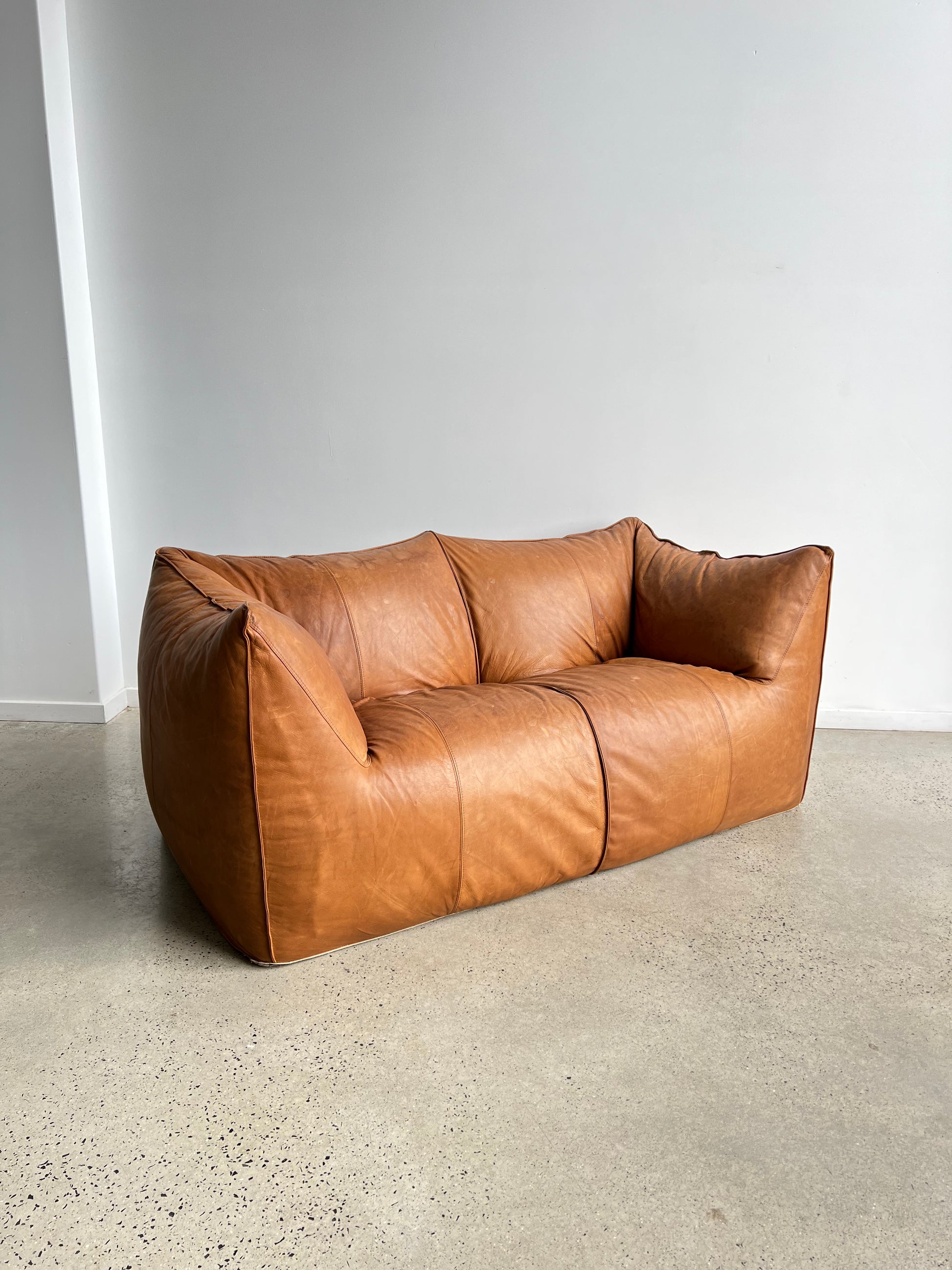 brown leather sofa in a neutral space